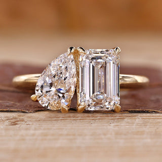 Toi et moi engagement ring with emerald and pear cut ring.