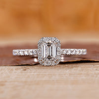 Emerald cut engagement ring with halo engagement ring.