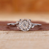 Portuguese cut engagement ring with a split shank band.