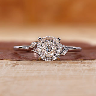 Portuguese cut engagement ring with a split shank band.