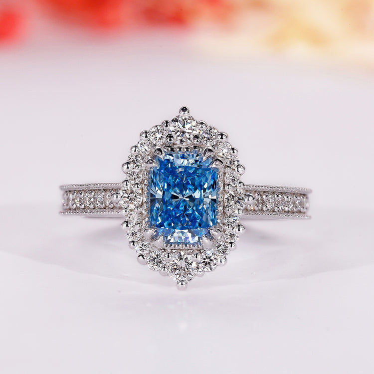 Blue diamond ring with radiant cut engagement ring.