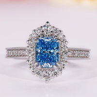 Blue diamond ring with radiant cut engagement ring.