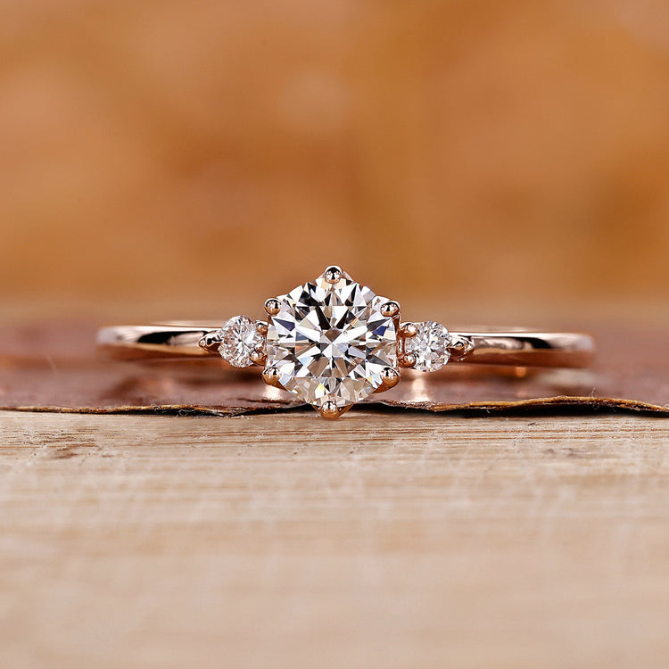 Three stone engagement ring with round diamond ring.
