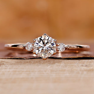 Three stone engagement ring with round diamond ring.