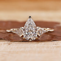 3 Stone Diamond Engagement Ring with pear cut diamond ring.