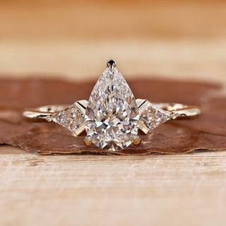 3 Stone Diamond Engagement Ring with pear cut diamond ring.