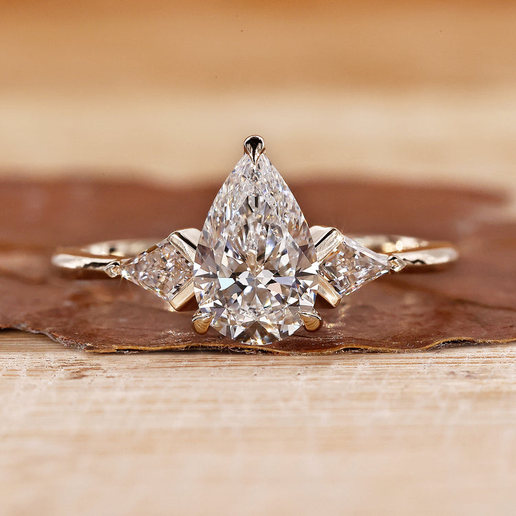 3 Stone Diamond Engagement Ring with pear cut diamond ring.
