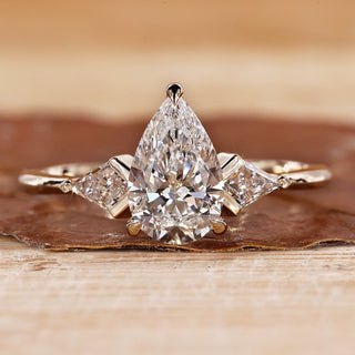 3 Stone Diamond Engagement Ring with pear cut diamond ring.