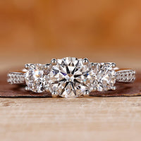 3 stone diamond engagement ring with tapered pave engagement ring.
