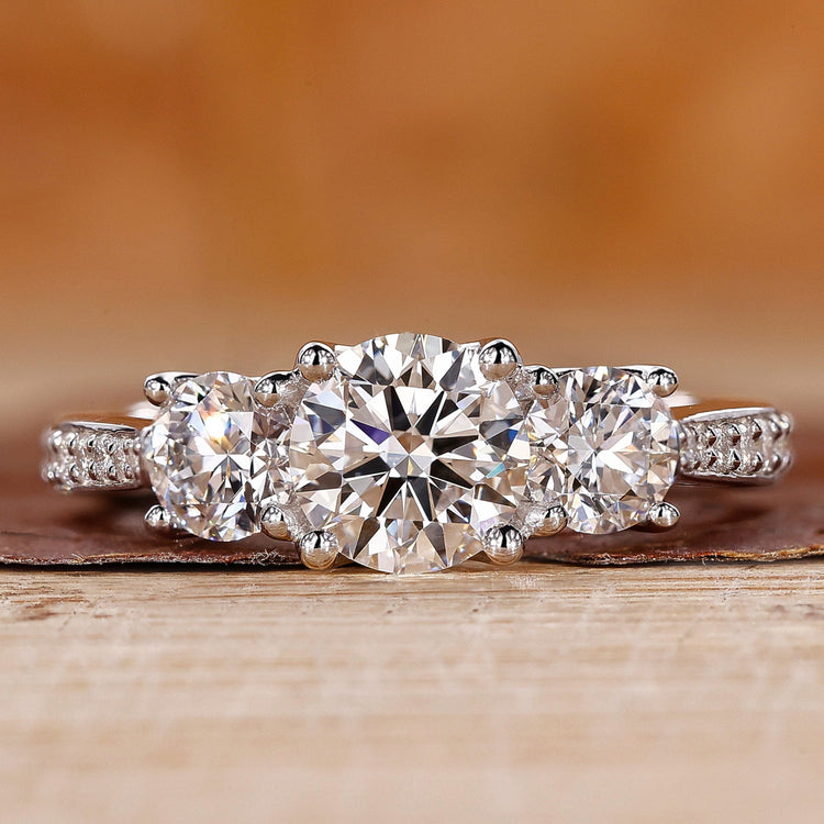 3 stone diamond engagement ring with tapered pave engagement ring.