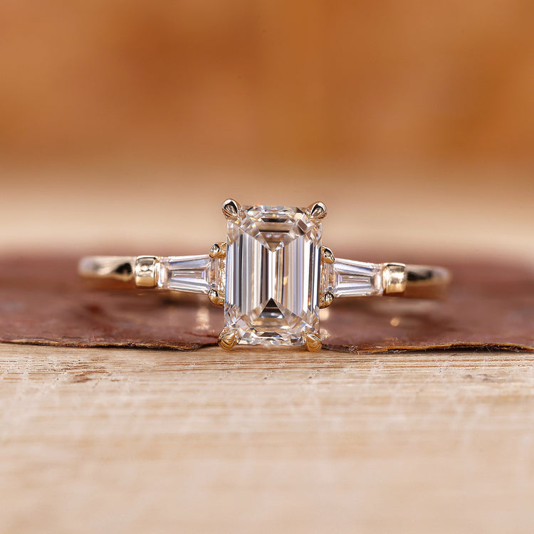 Emerald cut engagement ring with Tapered Baguette side stone.