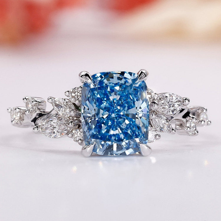 Blue diamond engagement ring with elegant sparkle.