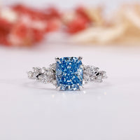 Blue diamond engagement ring with elegant sparkle.