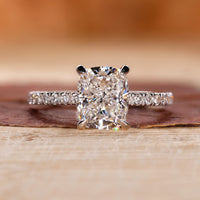 Cushion cut diamond ring with a hidden halo engagement ring.
