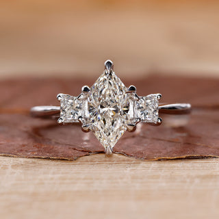 3 stone engagement ring with princess cut side stones.