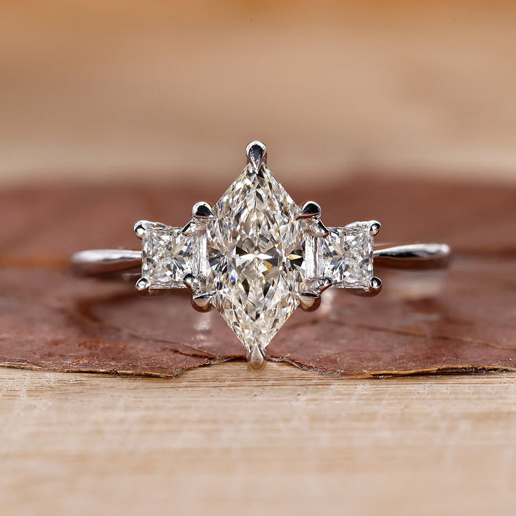 3 stone engagement ring with princess cut side stones.