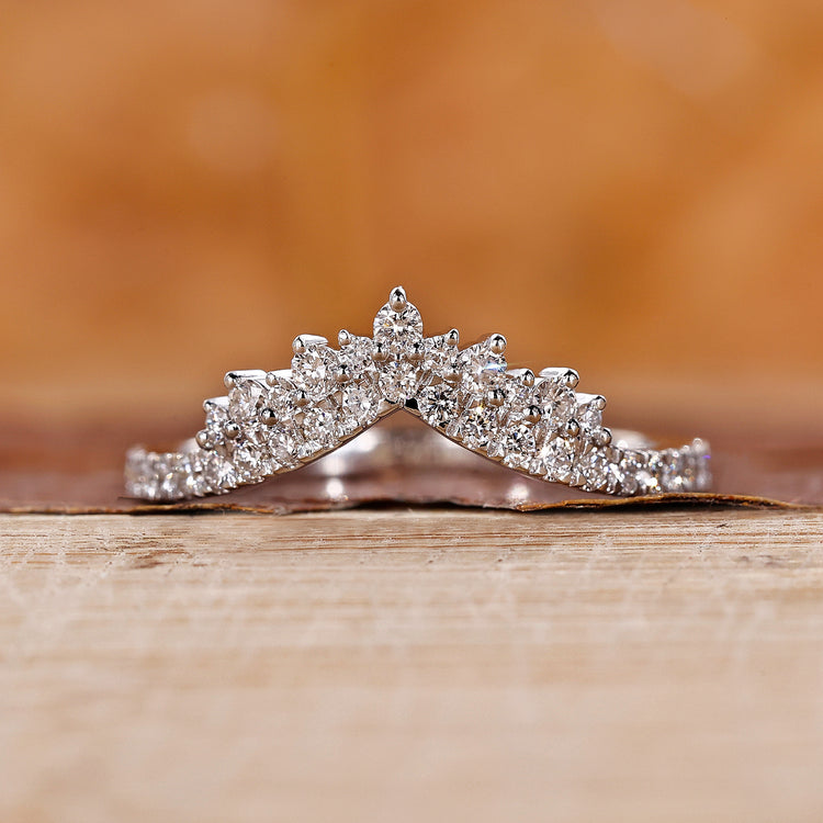 White gold wedding band with round cut diamond band.