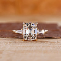Cushion cut diamond ring with 4 claw prong.