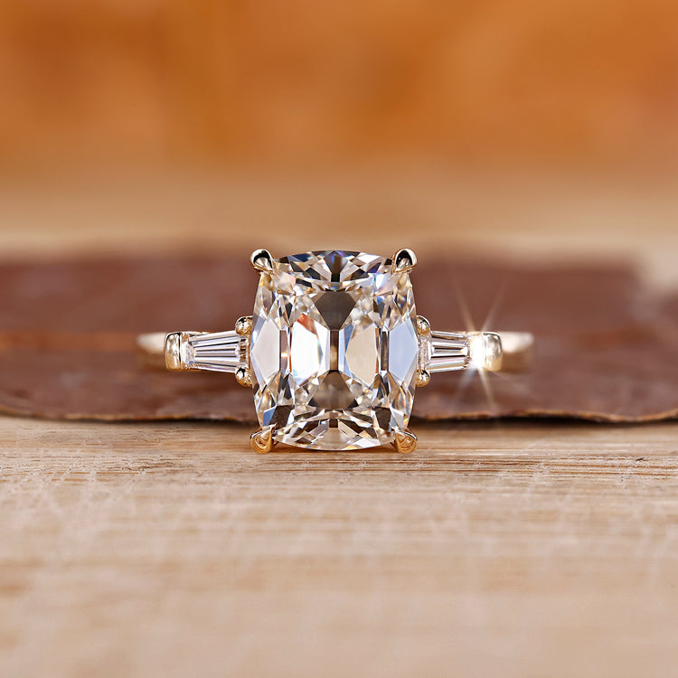 Cushion cut diamond ring with 4 claw prong.