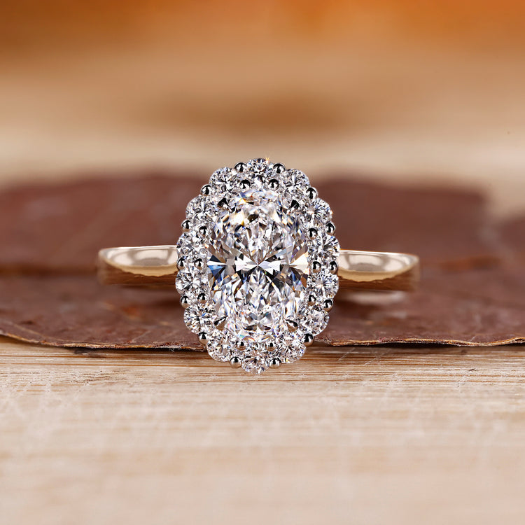 Oval cut engagement ring with 4 claw prong.