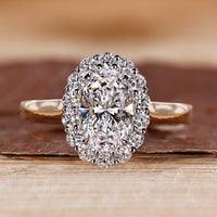 Oval cut engagement ring with 4 claw prong.