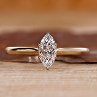 Marquise diamond engagement ring with tulip setting ring.
