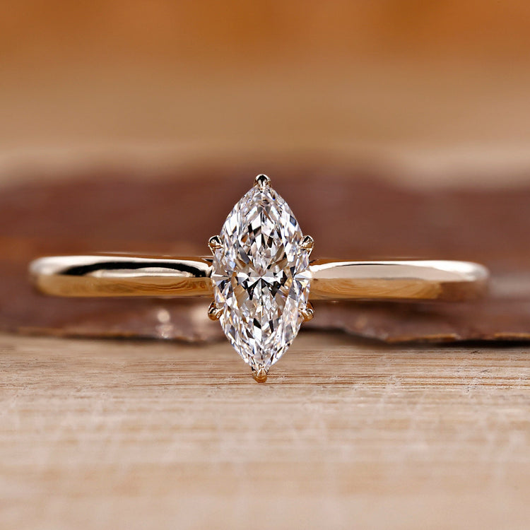 Marquise diamond engagement ring with tulip setting ring.