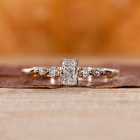 5 stone diamond ring in yellow gold setting.