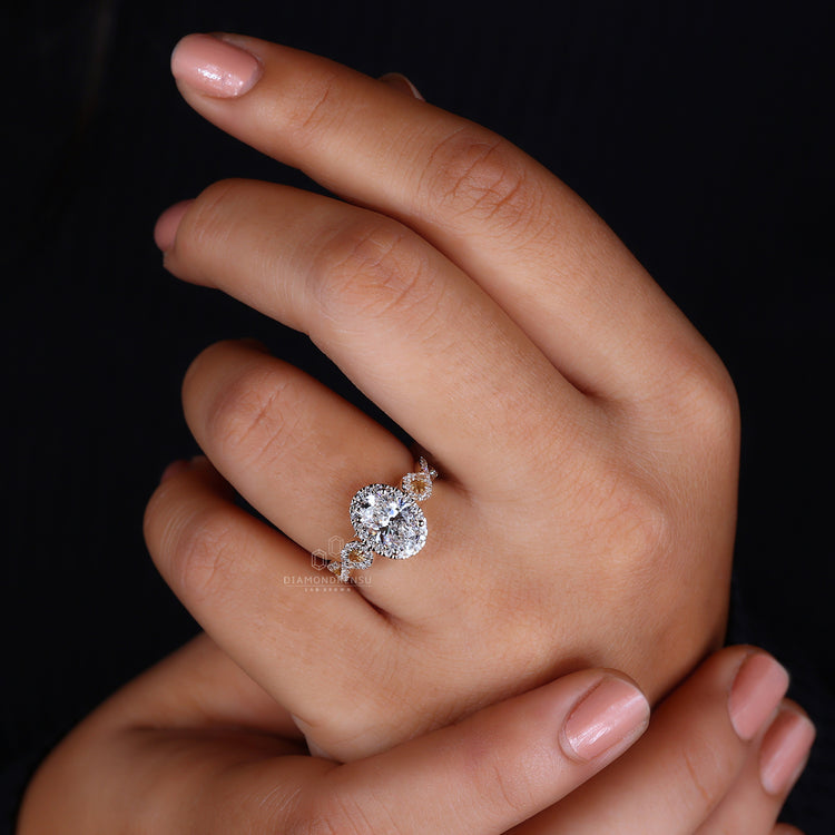 Handmade ring with twisted pave band and halo diamond setting.