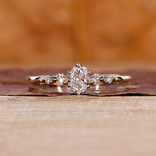 Oval diamond engagement ring with 5 stone engagement ring.