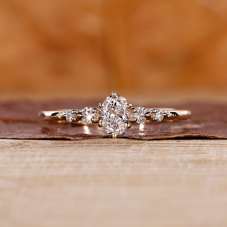 Oval diamond engagement ring with 5 stone engagement ring.
