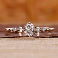 Oval diamond engagement ring with 5 stone engagement ring.