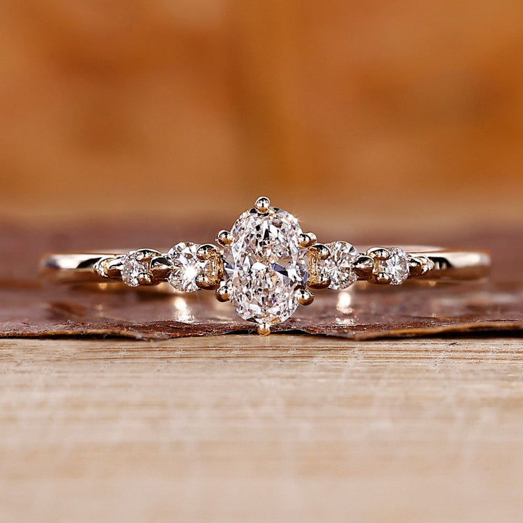 Oval diamond engagement ring with 5 stone engagement ring.