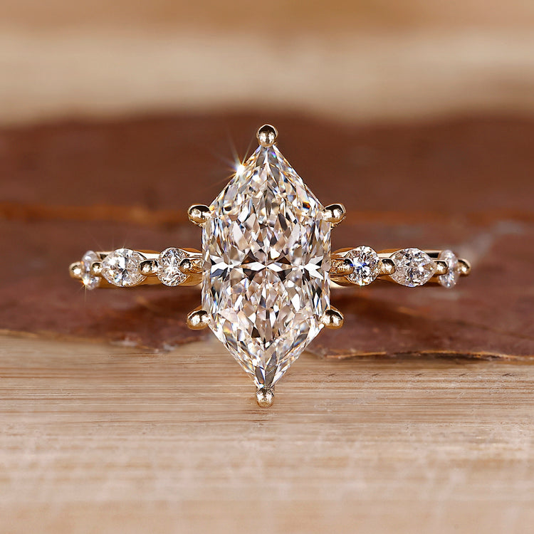 Dutch Marquise Cut Ring with 7 stone shared prong setting.
