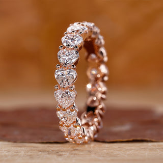 Heart shaped diamond band with prong setting.