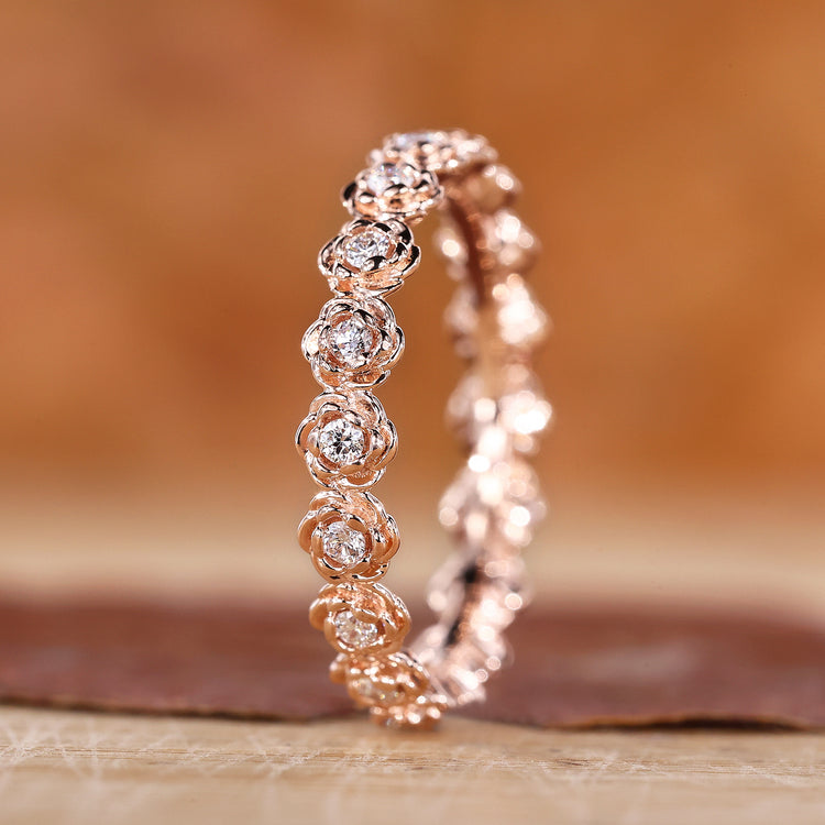 Flower style wedding band with rose gold wedding band.