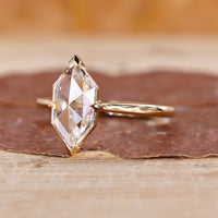 V prong setting solitaire diamond ring in yellow gold.