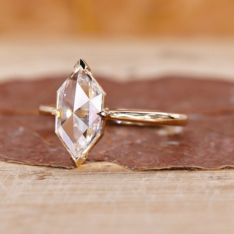 V prong setting solitaire diamond ring in yellow gold.