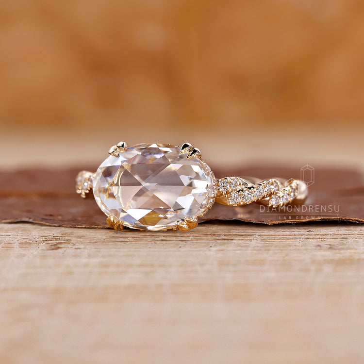 Round cut pave band in a yellow gold diamond ring setting.