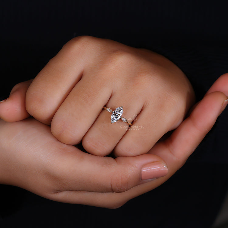 Customise ring with side stones and detailed settings.