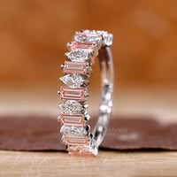 Pink baguette diamond band in prong setting.