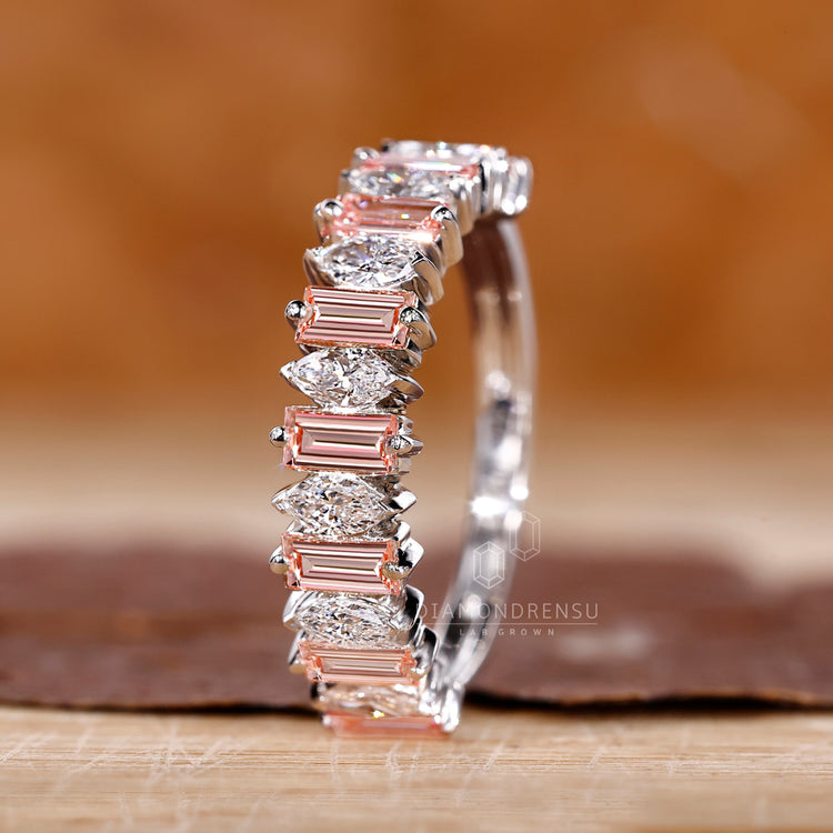 Pink baguette diamond band in prong setting.