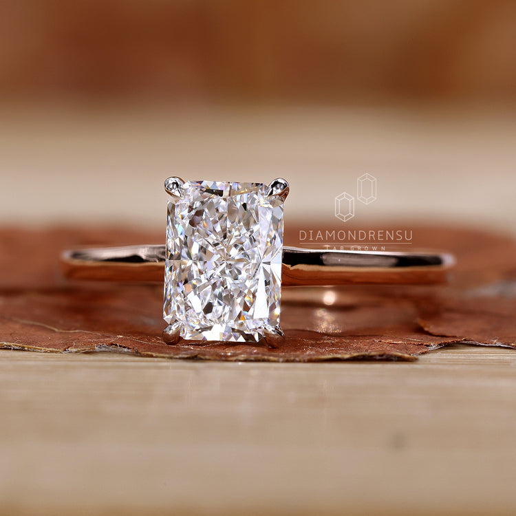 Two tone engagement ring in rose and white gold finish.