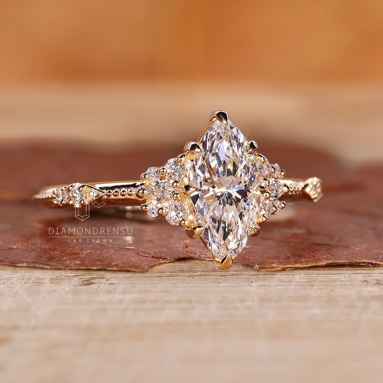 Round side diamond in a cluster engagement ring.