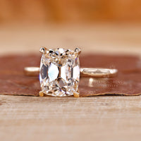 4 claw prong setting in old mine cushion cut diamond ring.
