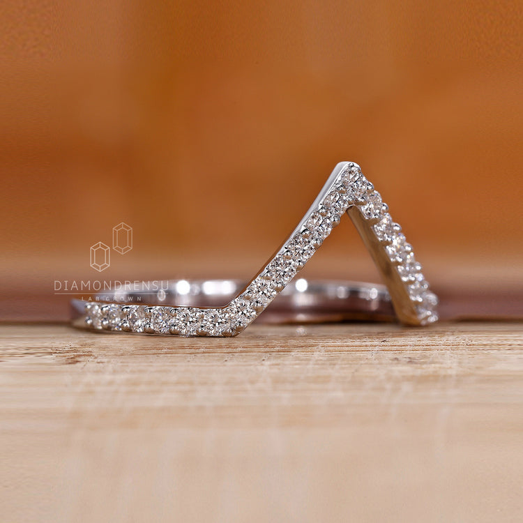 Curved diamond wedding band for engagement rings.