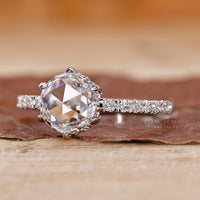 Round diamond pavé ring with hidden halo in white gold.