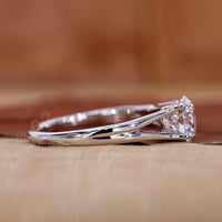 White gold engagement ring made in split shank style.