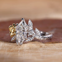 White gold ring with Dutch marquise diamond and nature inspired setting.