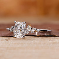 White gold ring with a handmade elongated cushion cut centre stone.